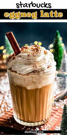 an eggnog latte is topped with whipped cream and cinnamon sticks