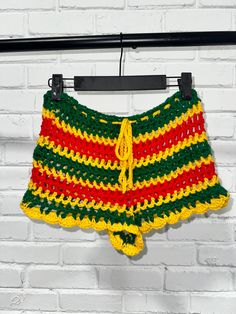 Crochet Mesh Shorts with Rasta or Grenada colors. 2 inch booty short inseam with ruffles. Tie closure at the waist for easy adjustments. Shorts are made to order, any size available using standard CYC guidelines. Can be made to your exact measurements if Hip measurement is provided. Fitted Crochet Casual Bottoms, Crochet Mesh Shorts, Rasta Crochet, Beach Wraps, Rasta Clothes, Reggae Festival, Mesh Crochet, Festival Clothes, Rasta Colors