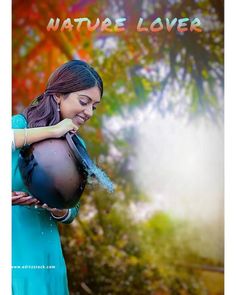 a woman holding a ball in her hands and smiling at the camera with nature lover written on it