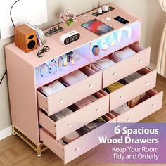 a pink dresser with drawers filled with various items