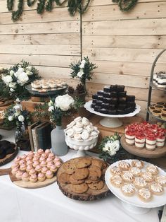 an assortment of desserts and pastries displayed on a table