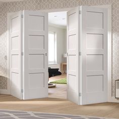 two white doors open in an empty room