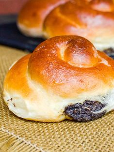 two hot cross buns sitting on top of a table