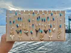 These necklace are all so gorgeous and unique & they vary in design! 🌊 Some necklaces have an oval link chain, this chain is 18K gold plated & lead and nickel free! 🦈 The other necklaces have a long lasting plated chain that has glass blue beads the links these are on are about 4mm x 20 mm they also include freshwater pearls ✨ Any necklace with a toggle has an 18K gold plated toggle, they also all have 18K gold plated extenders! Shark Teeth Jewelry, Whale Tail Necklace, Surf Jewelry, Shark Tooth Necklace, Tooth Necklace, Blue Shark, Seashell Jewelry, Toggle Necklace, Easy Diy Jewelry