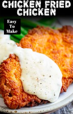 chicken fried chicken with gravy is served on a plate