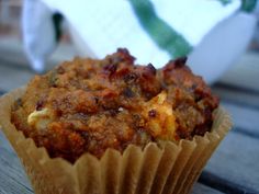 a muffin sitting on top of a wooden table