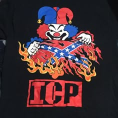 a t - shirt with an image of a clown holding a flag on it's chest