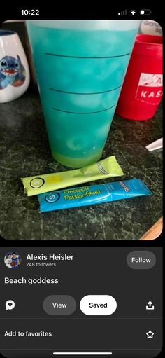 an image of a blue drink and some candy bars on a table with the caption'alxus helster beach goddess '