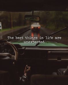 a car driving down a road with the words, the best things in life are unexpected