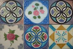 four tiles with different designs on them