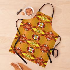 an apron is sitting on the table next to eggs