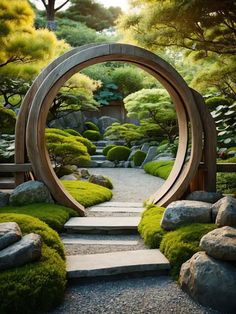 a garden with rocks, grass and trees in the middle is shown through an archway