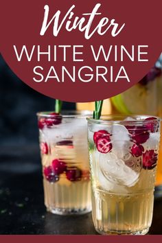 Two glasses of delicious, refreshing white wine sangrai with pitcher of sangria in background.