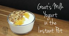 yogurt in the instant pot with granola and honey on top, sitting on a wooden table