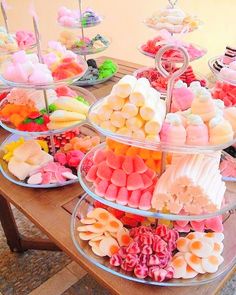 a table topped with lots of different types of desserts