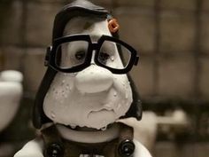 a close up of a statue of a dog wearing glasses and a pilot's helmet