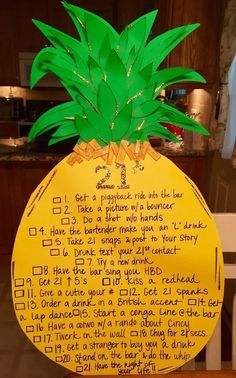 a paper pineapple with writing on it