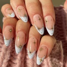 24 Pastel French Nail Ideas to Spring Your Mani Forward Round Nails Christmas Designs, Demure Christmas Nails, Fun Nye Nails, Star Nails Christmas, Round Holiday Nails, Almond Nails Designs Holiday, White Nails With Gold Stars, Christmas Star Nails Design, Star Christmas Nails