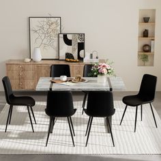 This dining set includes 1 rectangular table and chairs, and the overall design adds a sleek, modern look to your home. Each chair features a black steel frame, offering a clean and modern look. The seats are upholstered in a faux leather fabric, complementing various color schemes and styles. Foam padding ensures a comfortable dining experience, while the solid back design provides ample support. These chairs have a weight capacity of 250 lbs. and are rust-resistant for lasting appeal. Plus, th Black Steel Frame, Faux Leather Fabric, Dining Room Sets, Rectangular Table, Colour Schemes, Square Design, Black Steel, Leather Fabric, Back Design