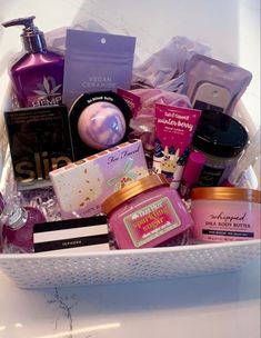 a white basket filled with lots of beauty products