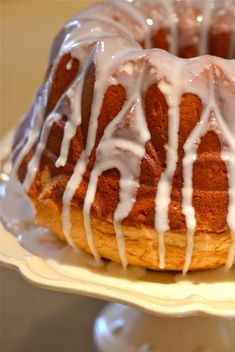 a bundt cake with white icing on a plate