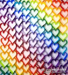 many hearts are arranged in rainbow colors