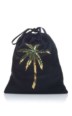 a black bag with a gold palm tree on it