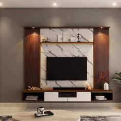 a modern living room with marble and wood accents on the wall, coffee table and television