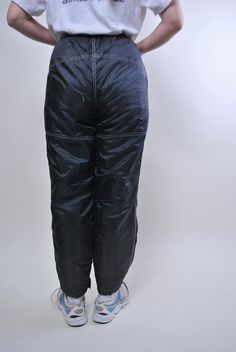 "Vintage women black skiing pants, retro snow trousers, Size M Welcome to TARASCOMMON.ETSY.COM Unique clothing from the 20th century. Model tall - 170cm Size: M. 14/164 - size on the tag. Width - 29-45cm / 11.41-17.71inch; Length - 105cm / 41.33inch. Hips - 50cm/ 19.68inch; Front rise - 31cm/ 12.2inch; All measurements are taken seam to seam while lying flat. Polyester/ Nylon; Belt. This item is vintage, so it can have some defects. Additional photos can be send We are glad that you are interest Retro Winter Streetwear Bottoms, Retro Winter Trousers, Vintage Winter Trousers, Vintage Trousers For Winter, Black Full Length Parachute Pants For Winter, Black Winter Hiking Bottoms, Vintage Full-length Winter Pants, Black Bottoms With Pockets For Ski Season, Black Bottoms For Ski Season