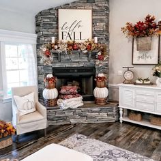 a living room filled with furniture and a fire place in front of a stone fireplace