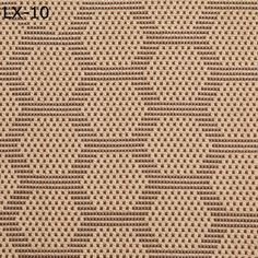 a close up view of the textured fabric in beige and brown tones, with small dots