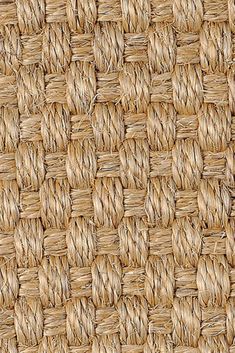 close up view of the woven material for a wallpaper or flooring piece in natural colors