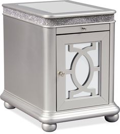 a small silver cabinet with an open door and glittered glass inserts on the top