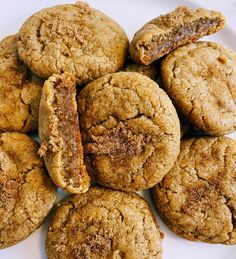 a pile of cookies sitting on top of a white plate