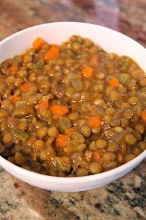 a white bowl filled with lentils and carrots