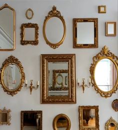 there are many different mirrors on the wall