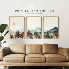 three paintings are hanging on the wall above a couch in front of a potted plant