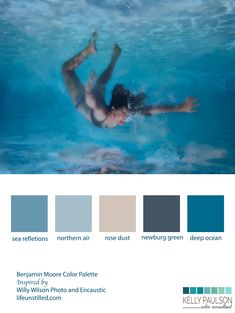 a man swimming in a pool with blue water and gray color palettes for the walls