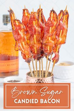 brown sugar candied bacon sticks in a copper cup with the words brown sugar candied bacon on it