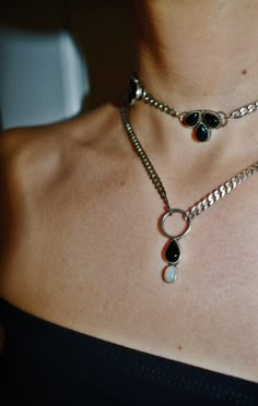 Opposites attract: ying & yang, dark & light, feminine & masculine, onyx & opal.  O-ring necklace with curb chain, a tear drop onyx and an oval welo opal.  All sterling silver construction. Wear her like a choker or wear her like a necklace. Adjustable, as tight as you'd like to 16in. Message me if you need an extender. Made-to-order & handmade by me, in my Austin, TX studio. Some variation make occur. You may see tiny wabi-sabi marks from my tools. Whimsigoth Style, Feminine Masculine, Light Feminine, Fairycore Grunge, Necklace Opal, Ring Der O, Opposites Attract, Dark Light, Funky Jewelry