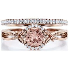 an engagement ring set with a pink morganite surrounded by diamonds