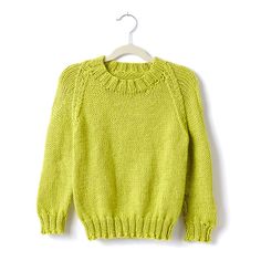 a yellow sweater hanging on a hanger