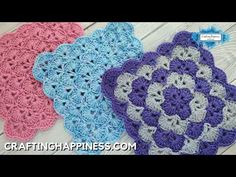 three crocheted coasters sitting on top of a wooden table