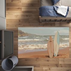 there are two surfboards on the beach next to the bed in this room with wood flooring