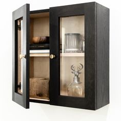 a wooden cabinet with glass doors on the front and shelves below it, filled with items