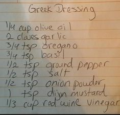 a handwritten recipe for greek dressing