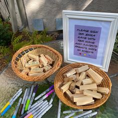 there are many crayons on the table and one is next to a basket