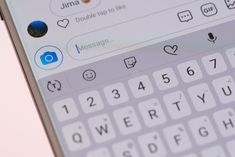 the keyboard on an iphone is shown in close up with other icons and symbols behind it