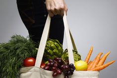 a tote bag filled with fruits and vegetables