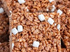 several squares of granola with marshmallows on top